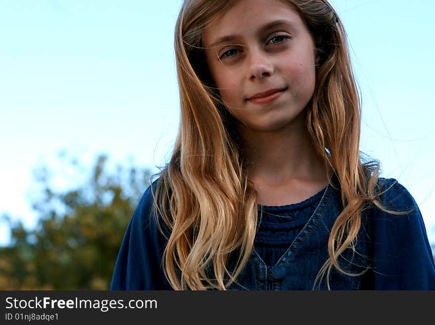 Beautiful Little Girl Smiles at the Camera