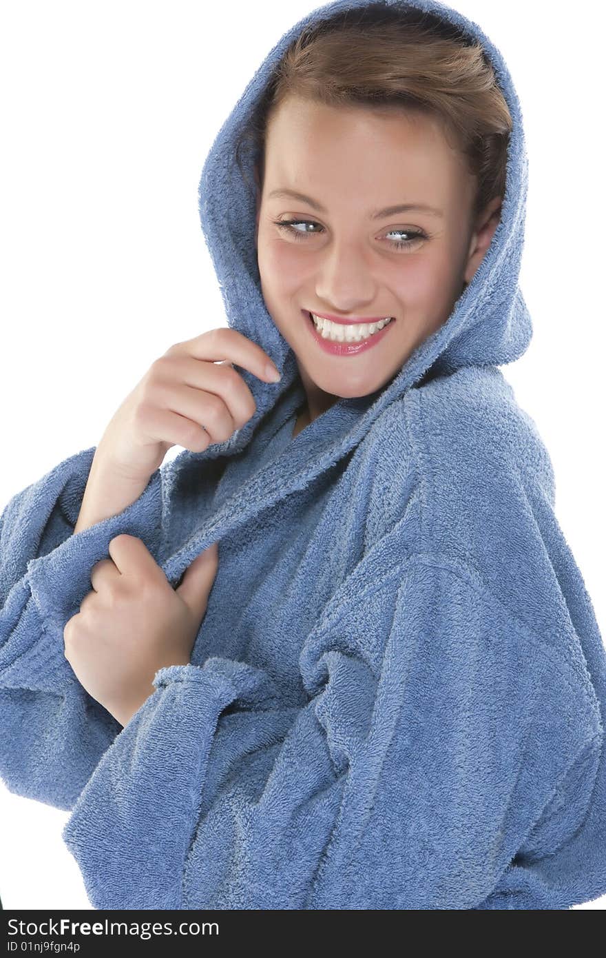 Smiling woman in bathrobe. Isolated over white bac