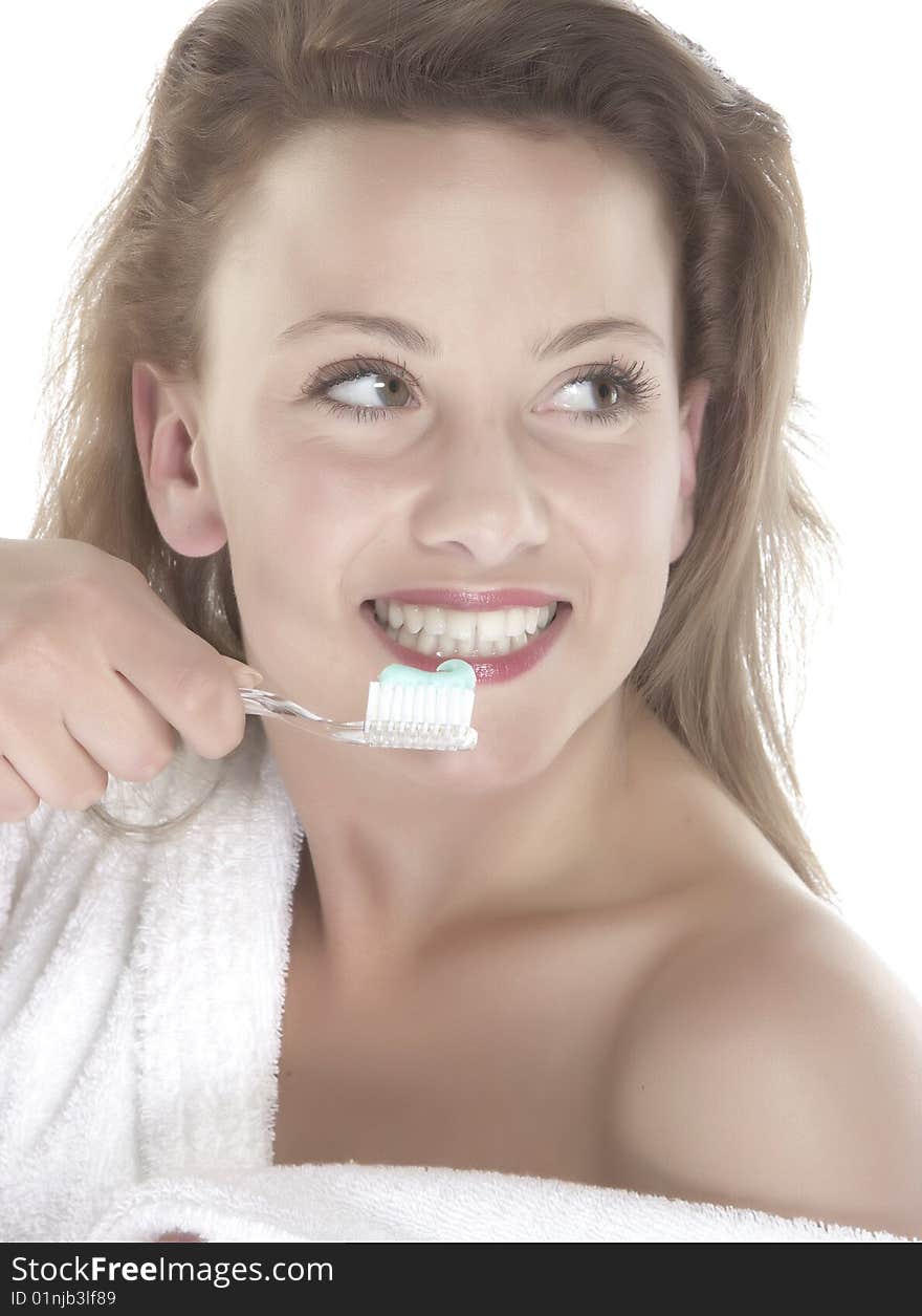 Girl who wash their teeth on white background