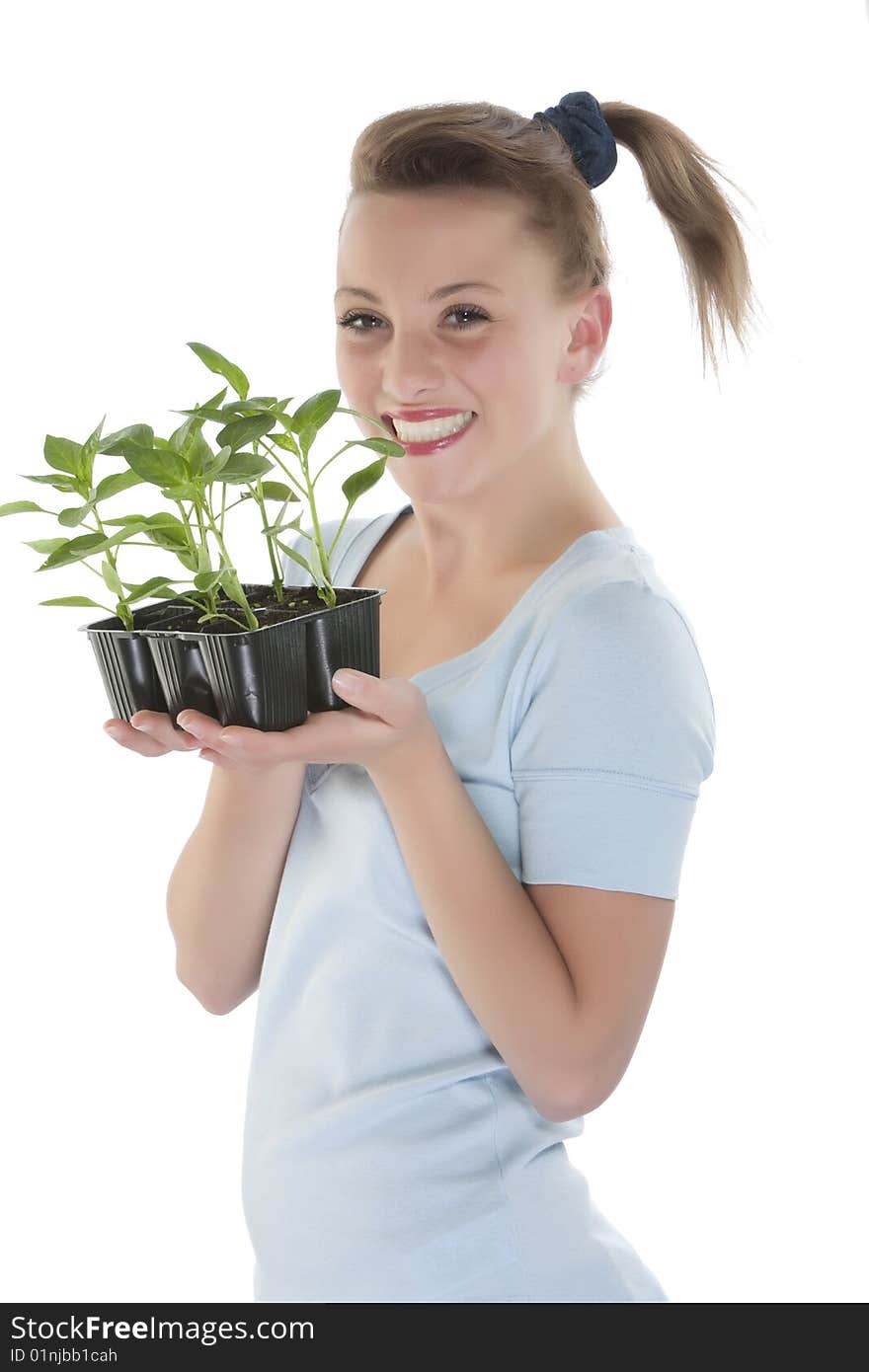 Girl holding young plants