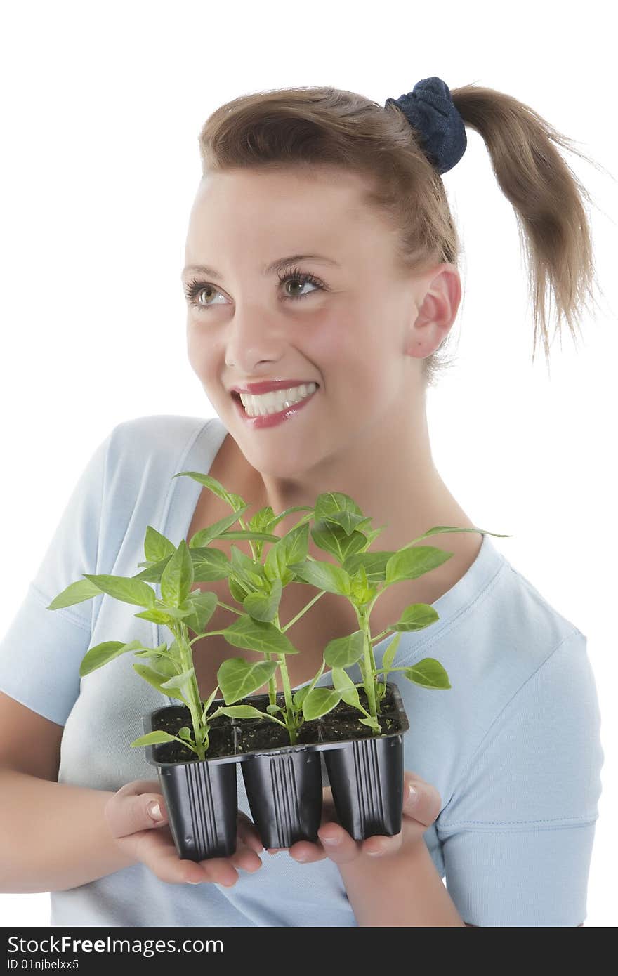 Girl holding young plants