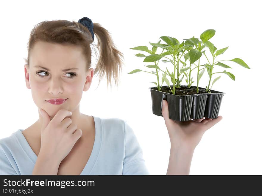 Girl holding young plants