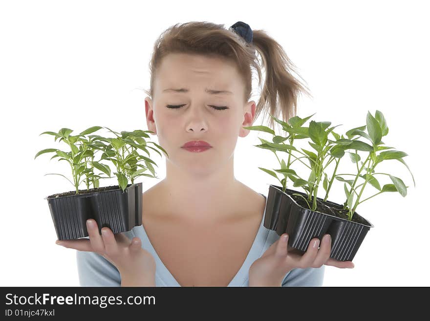 Girl holding young plants