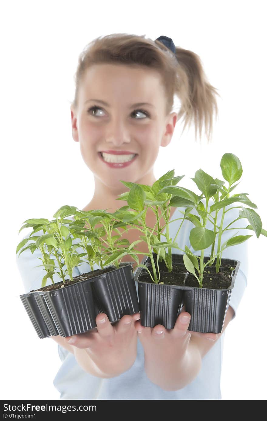 Girl holding young plants