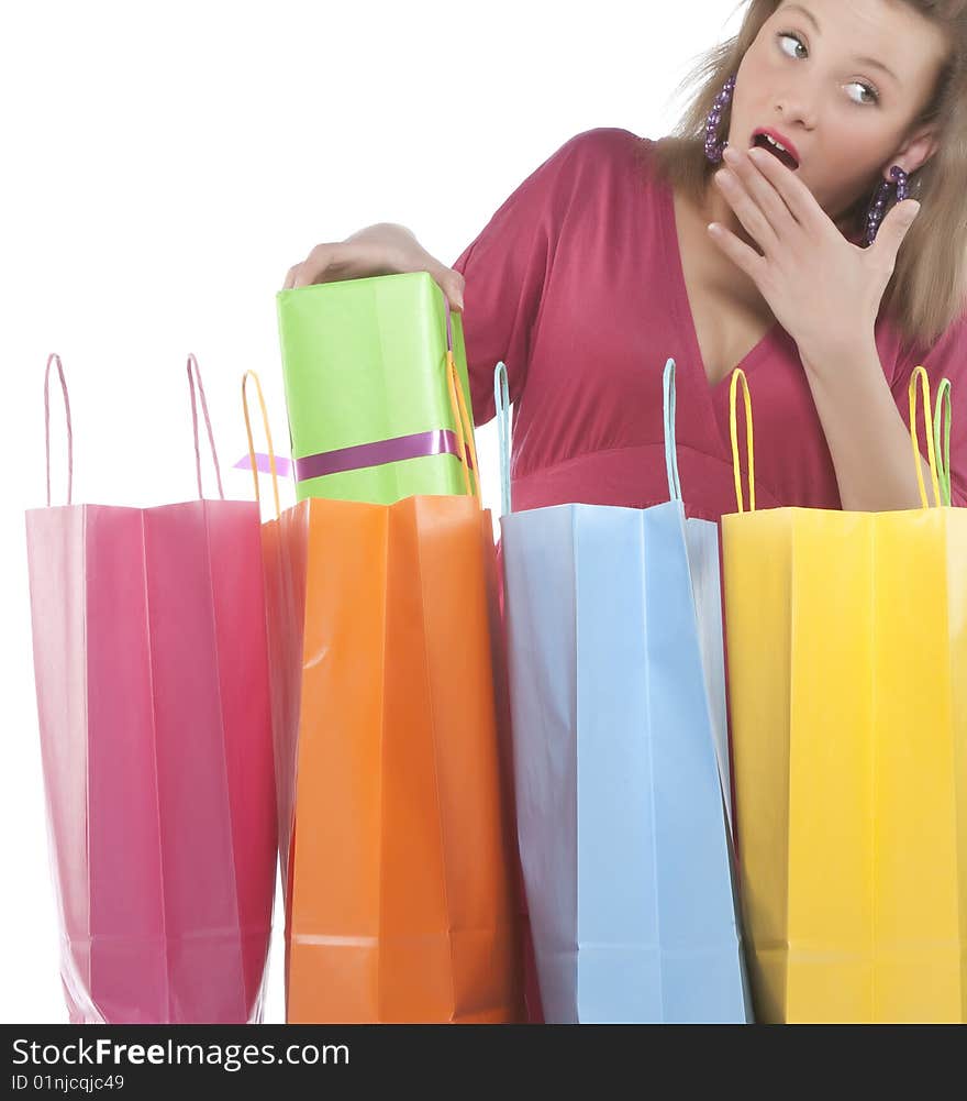 Attractive young woman holding several shoppingba