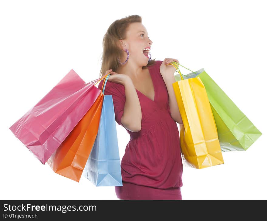 Attractive young woman holding several shoppingba