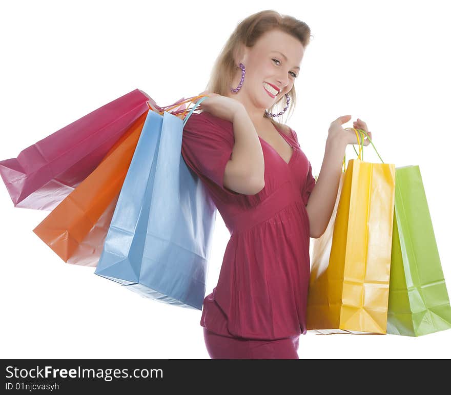 Attractive young woman holding several shoppingba