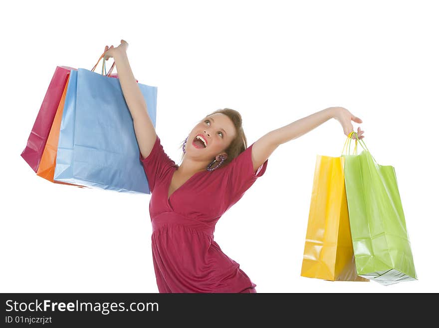 Portrait of an attractive young woman holding several shoppingbags.