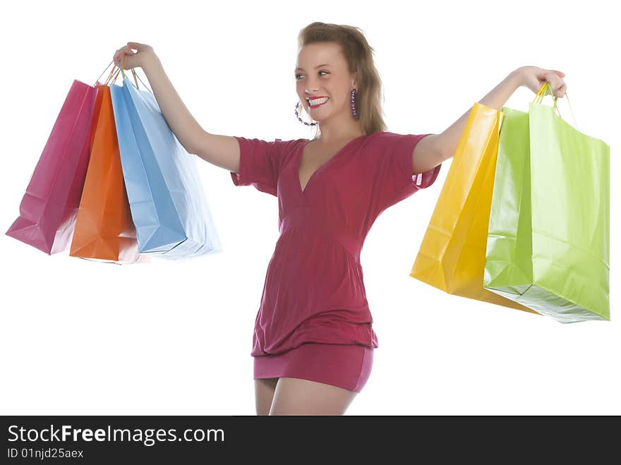 attractive young woman holding several shoppingba