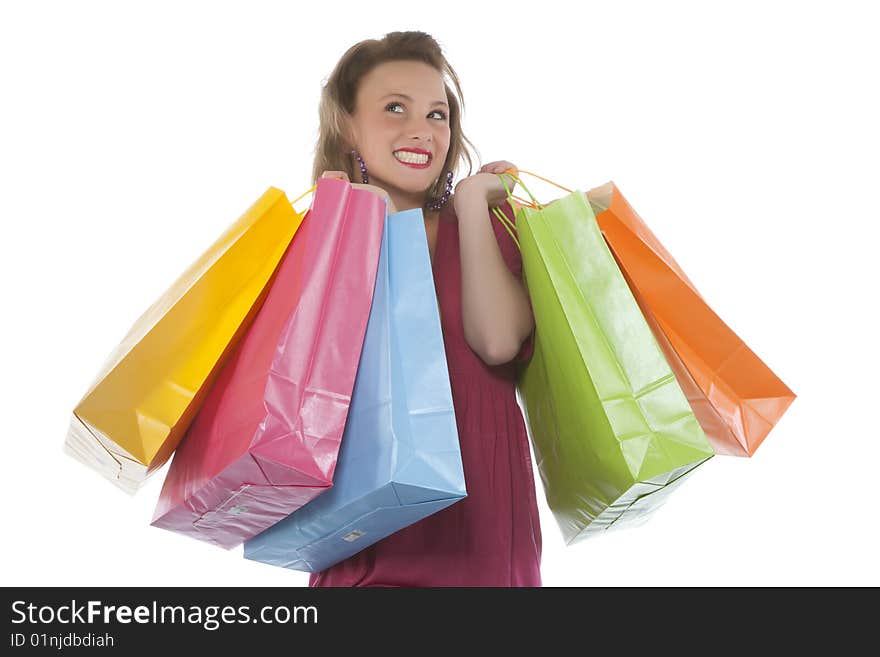 Portrait of an attractive young woman holding several shoppingbags.