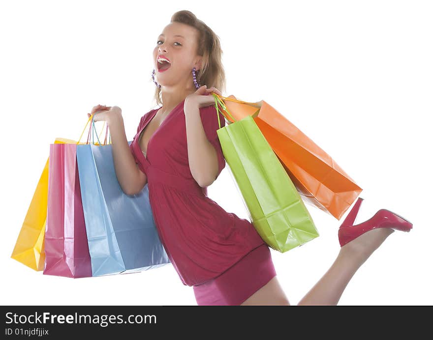 Portrait of an attractive young woman holding several shoppingbags.