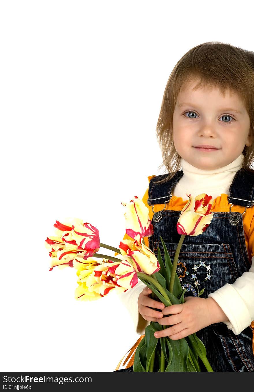 Cute little girl giving tulips. Studio shot