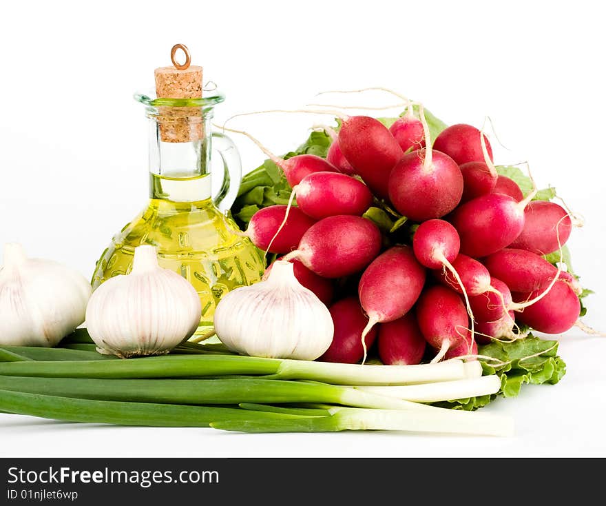 Green vegetables and  bottle of oil