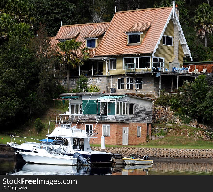 Waterfront home on river with boats