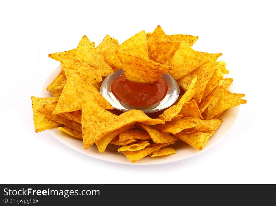 Salsa dip in a bowl on brown background