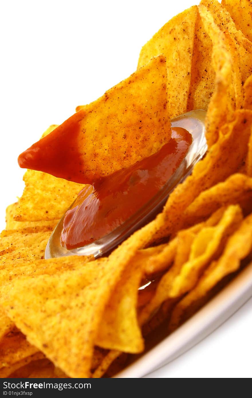 Salsa dip in a bowl on brown background