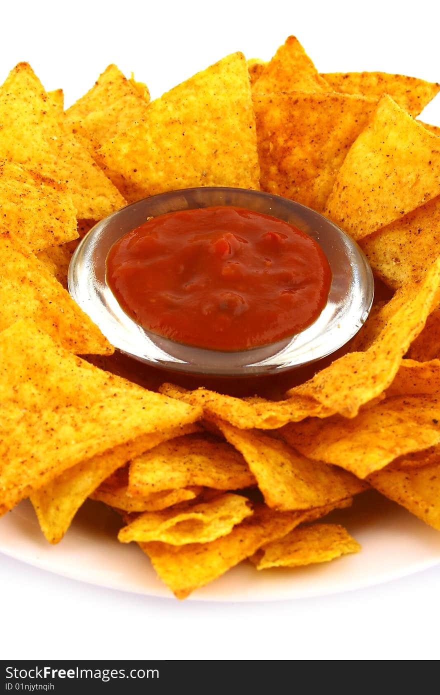 Salsa dip in a bowl on brown background