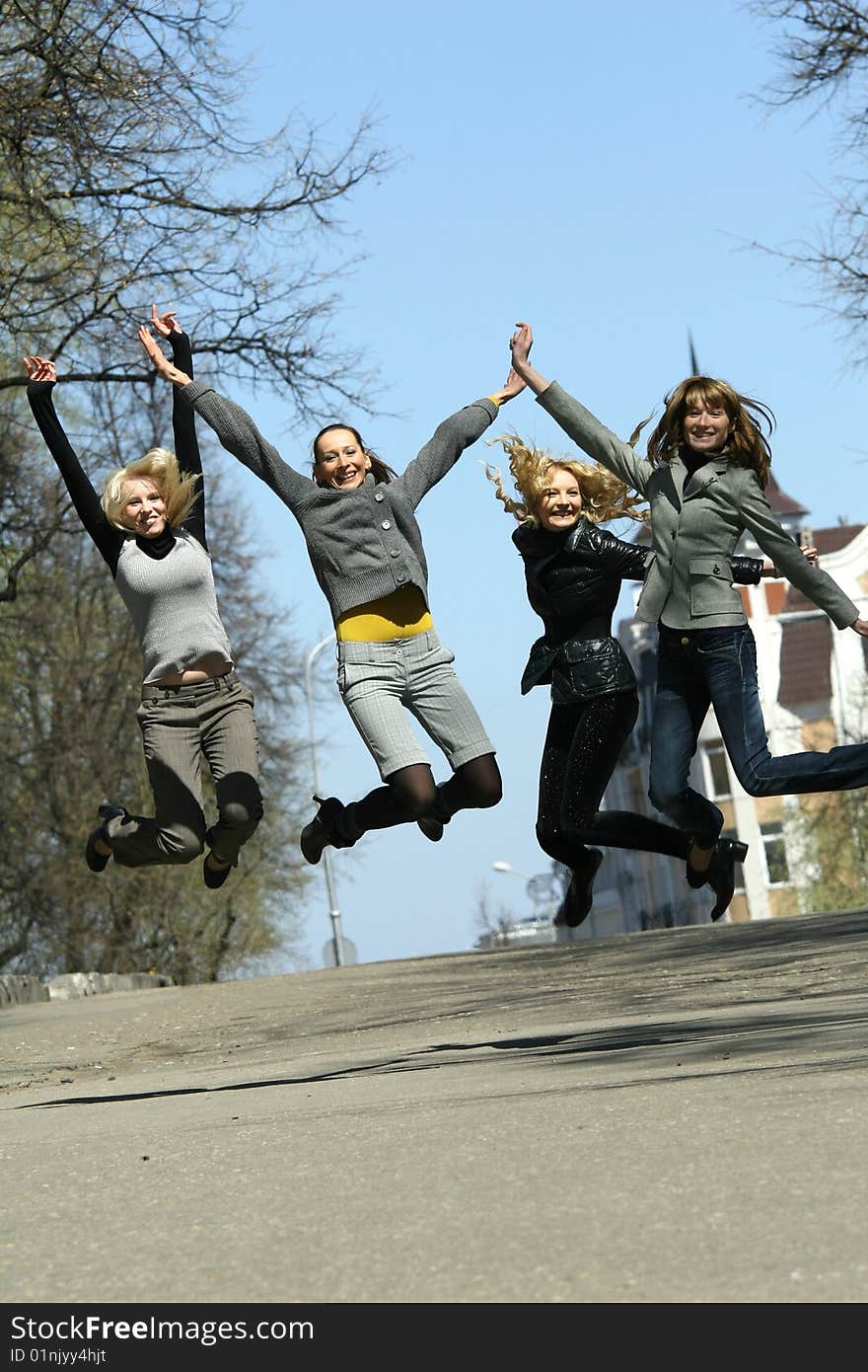 Group of girls jumping on the street. Group of girls jumping on the street