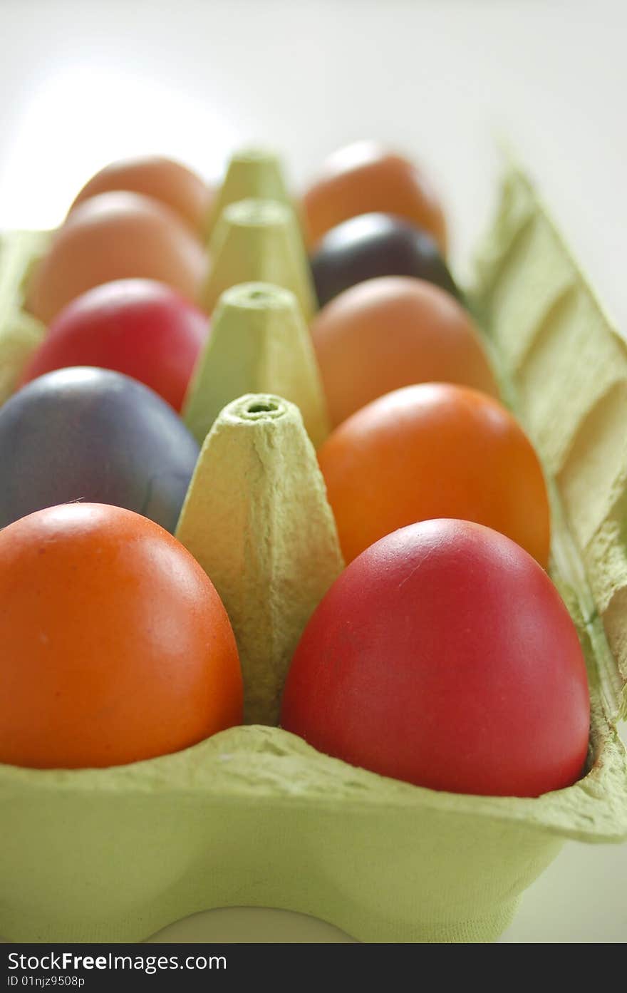 Colored eggs in egg box at easter time. Colored eggs in egg box at easter time