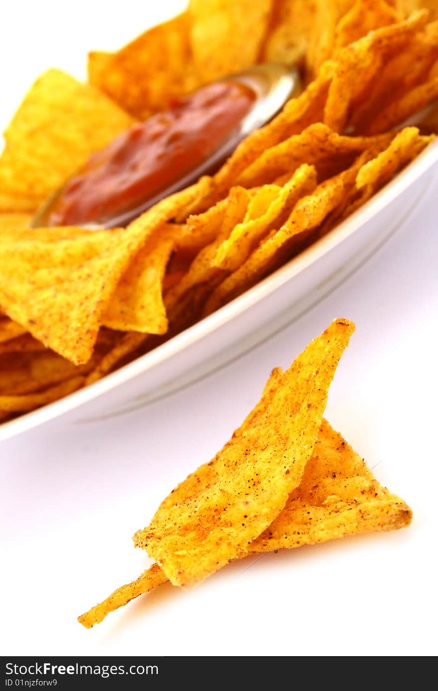 Salsa dip in a bowl on brown background