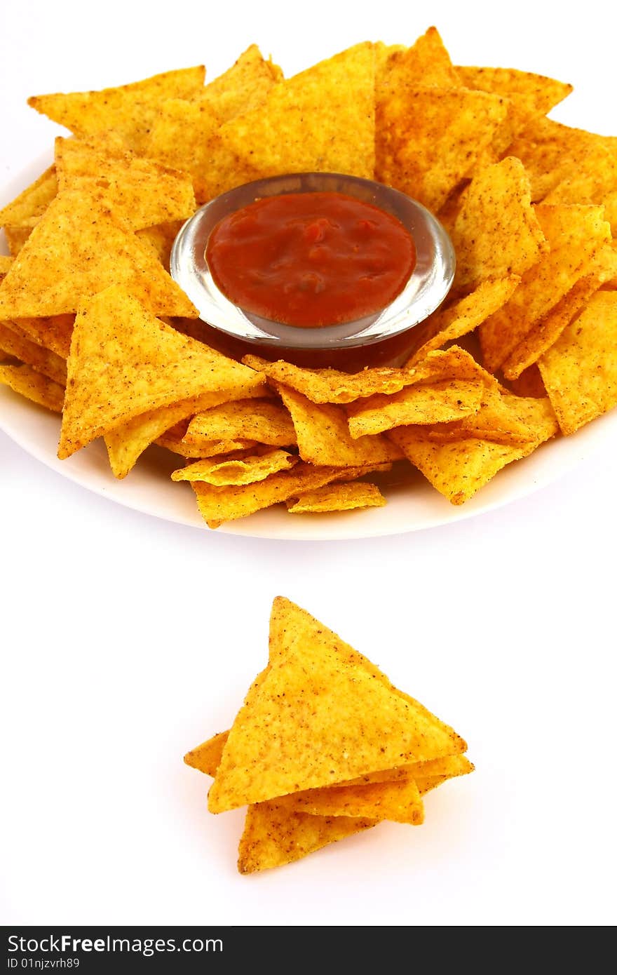 Salsa dip in a bowl on brown background