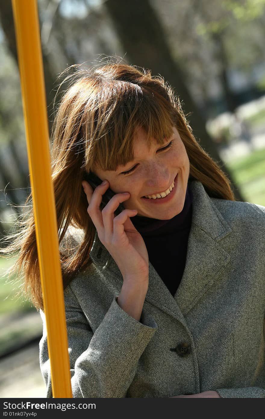 Causal woman talking on a mobile phone outdoor. Causal woman talking on a mobile phone outdoor