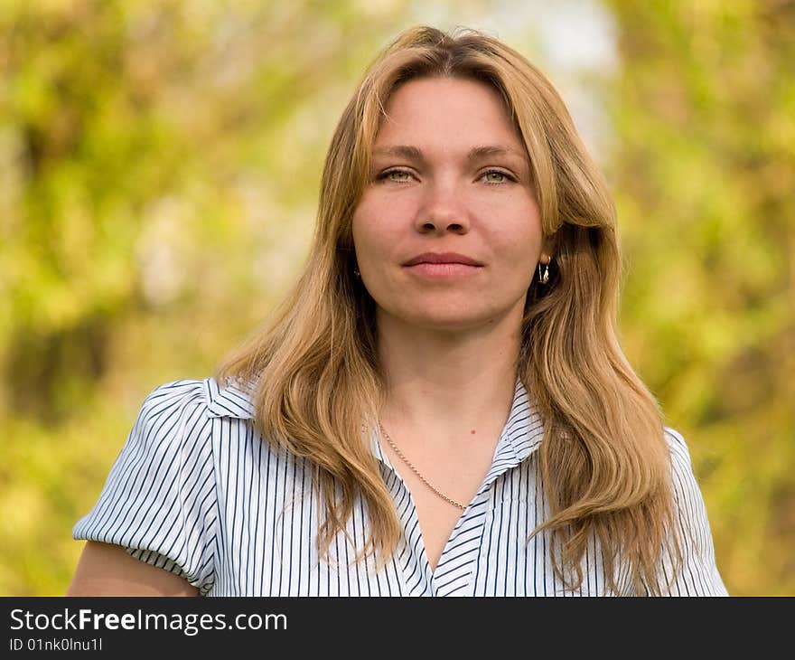 Beauty woman on background of the foliage