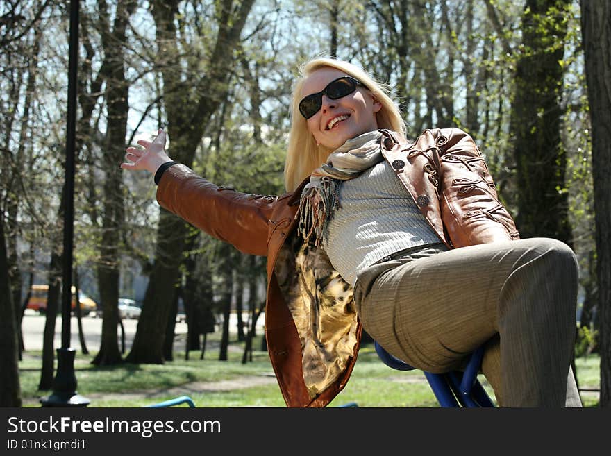 Happy Woman On A Swing