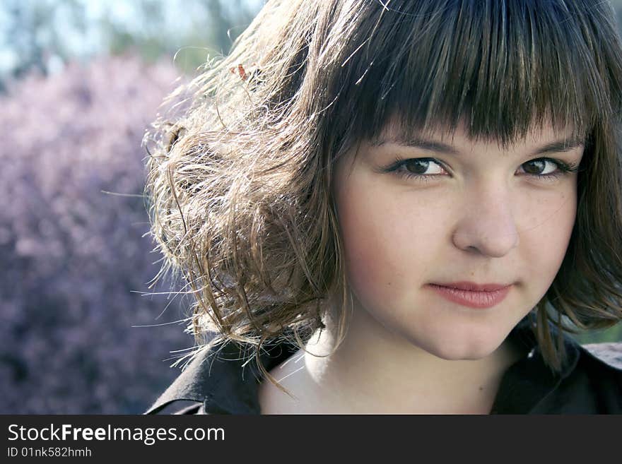 Beautiful girl and spring blossom