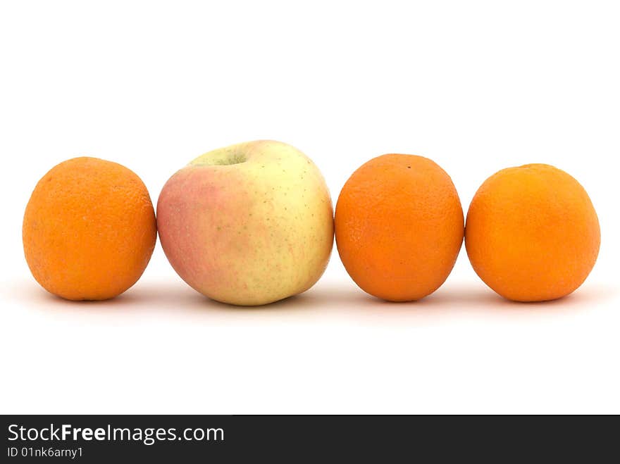 Apple and oranges on the white background