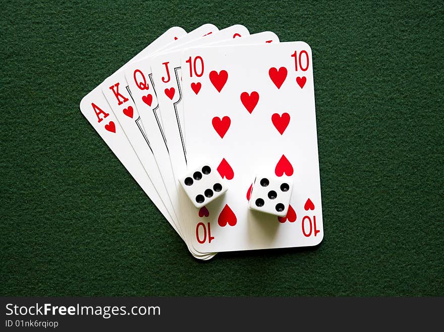 Five cards  - royal flush ont the green table