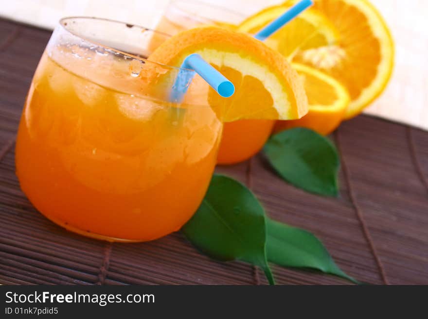 Orange and orange juice in a glass. Orange and orange juice in a glass