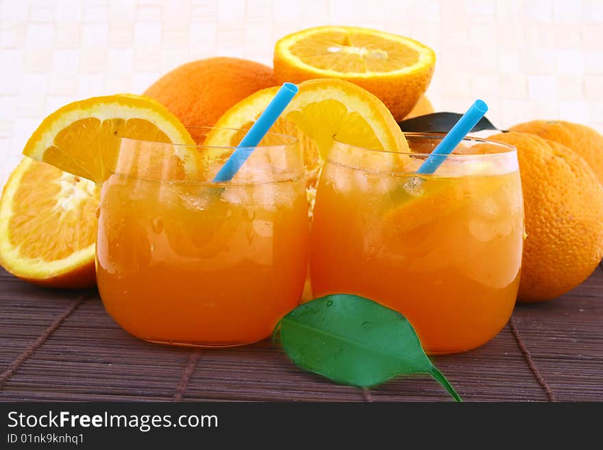 Orange and orange juice in a glass. Orange and orange juice in a glass