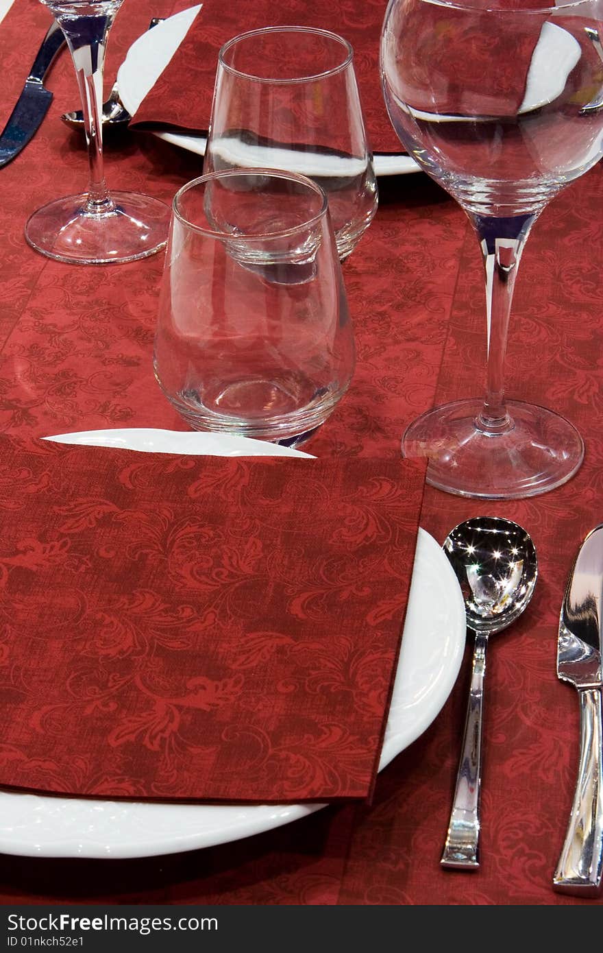 Red Elegant Table Setting with Drinking Glasses. Red Elegant Table Setting with Drinking Glasses