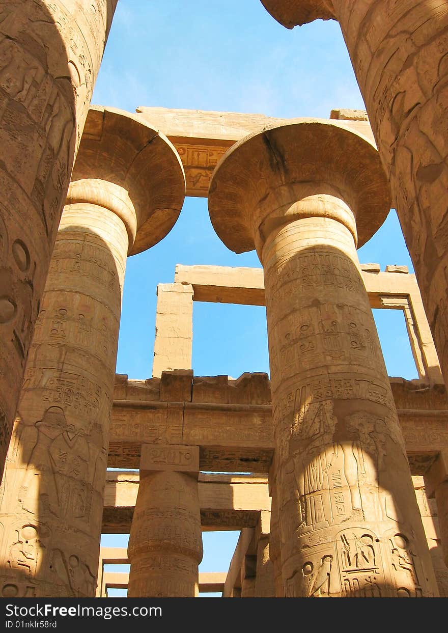 Grandiose colonnade of hypostile hall in the Temple of Amun-Ra at Karnak. Antique Thebes. Luxor, Egypt. Grandiose colonnade of hypostile hall in the Temple of Amun-Ra at Karnak. Antique Thebes. Luxor, Egypt.