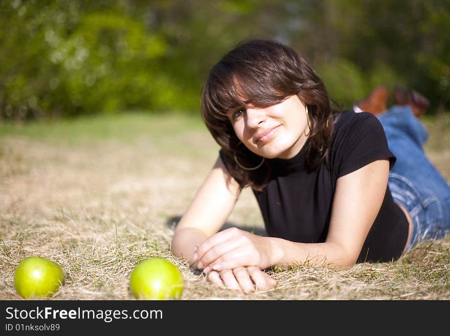 The beautiful young girl with two apples