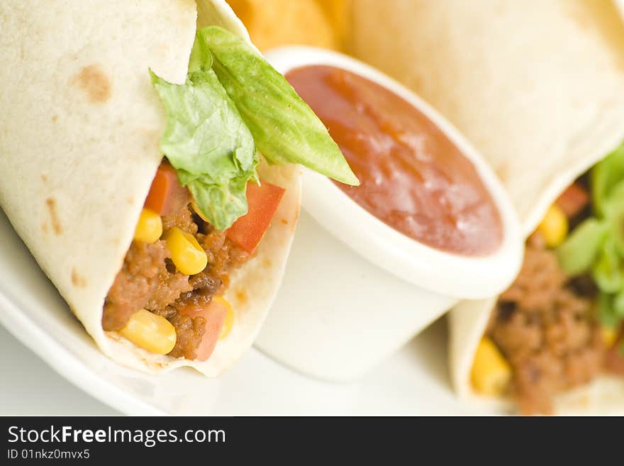 Delicious fajitas beef lettuce tomato pepper corn isolated