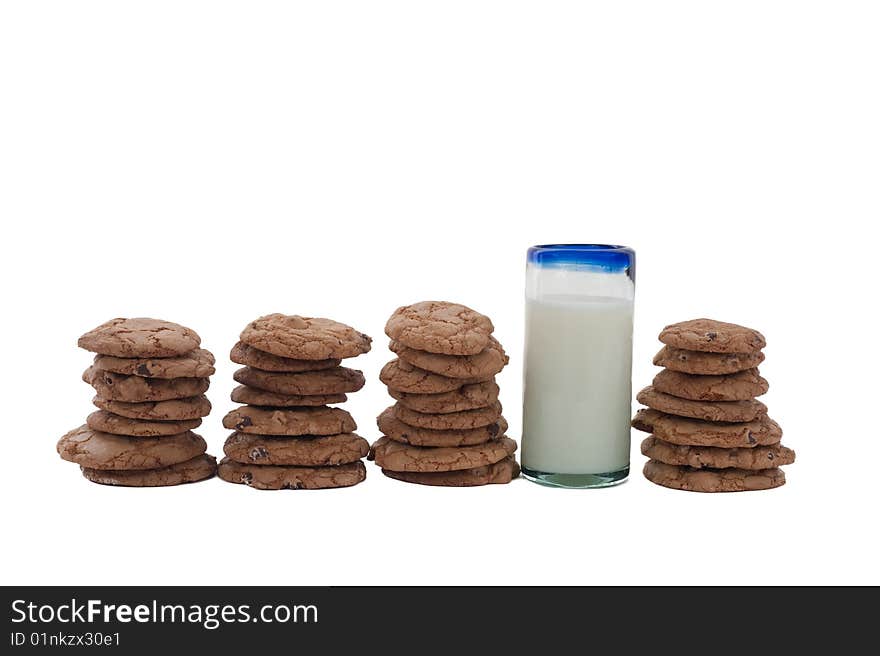 Cookies arrange in a row, with a glass of milk. Cookies arrange in a row, with a glass of milk.