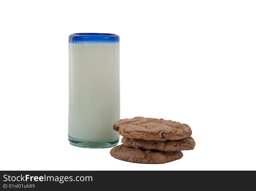 Stack of chocolate chip cookes and a glass of milk. Stack of chocolate chip cookes and a glass of milk.