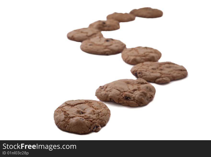 Chocolate chip cookies arranged as in a winding path. Chocolate chip cookies arranged as in a winding path.