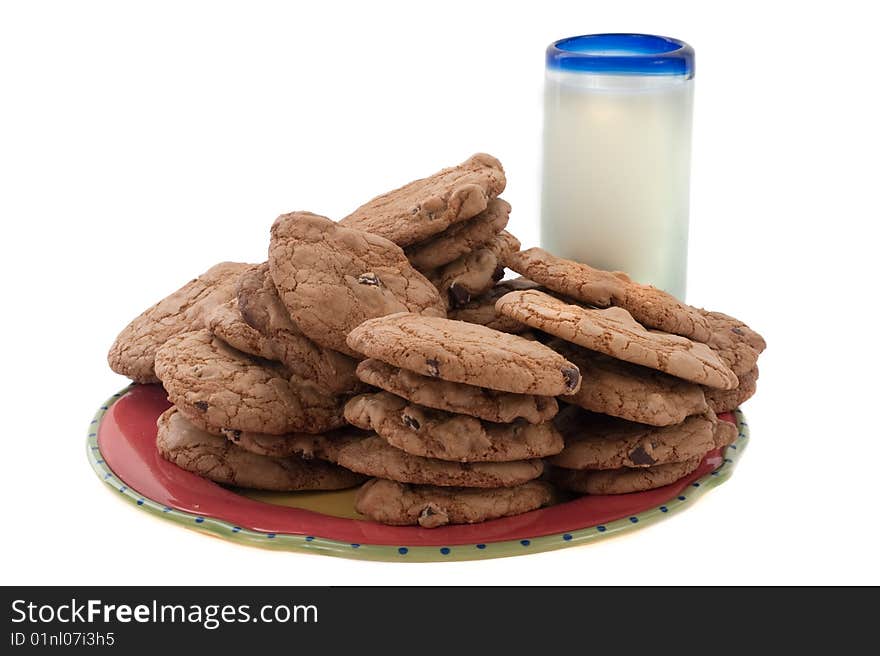 Stack of chocolate chip cookes and a glass of milk. Stack of chocolate chip cookes and a glass of milk.