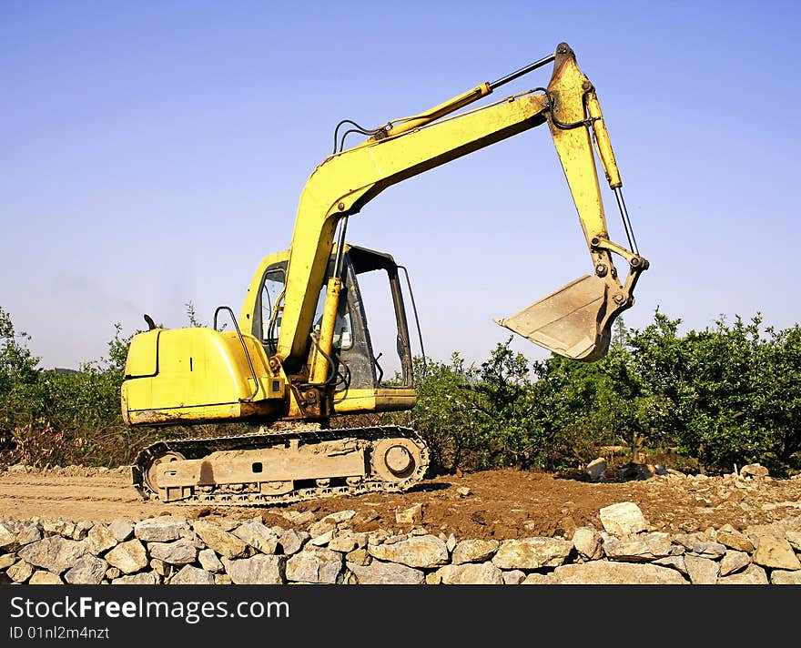 Orange excavator at construction site