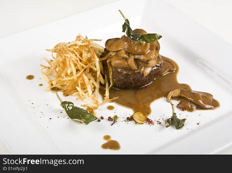 Veal with CEPS and potato chips. Veal with CEPS and potato chips