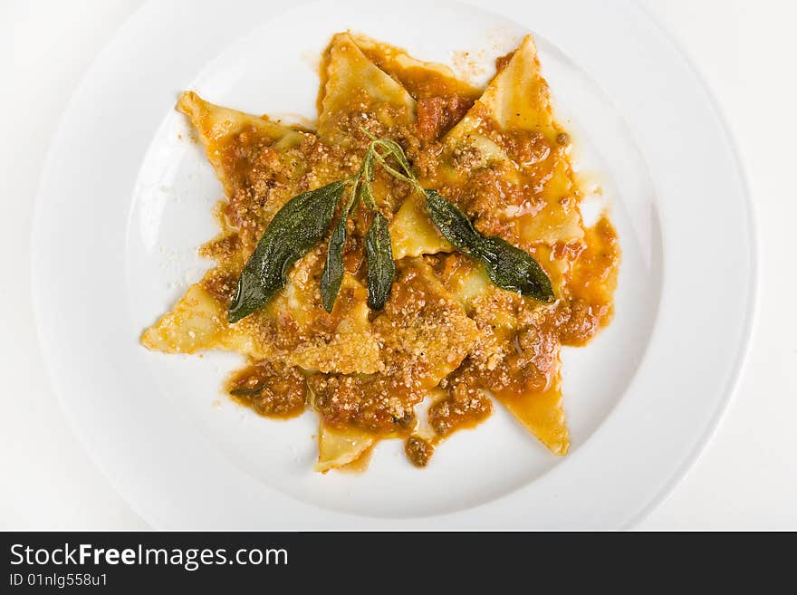 Italian ravioli versel'ez by a sauce and greenery