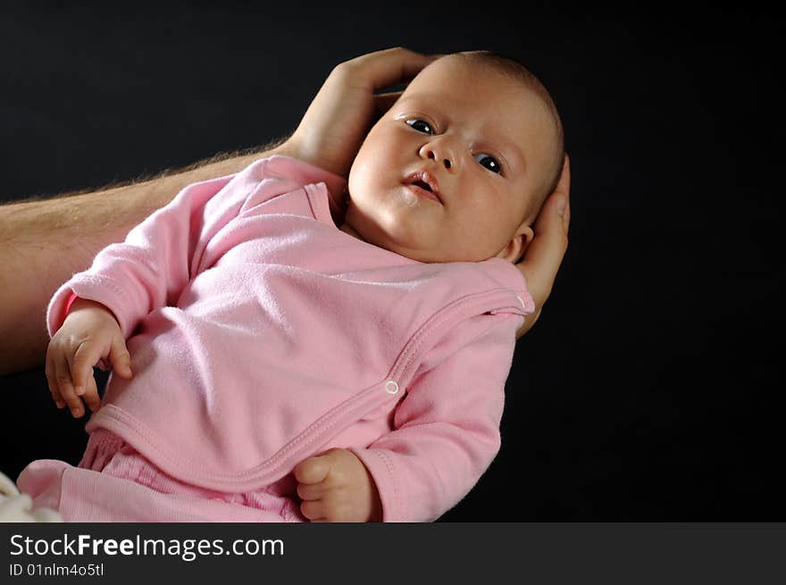 Little baby in dad's hands