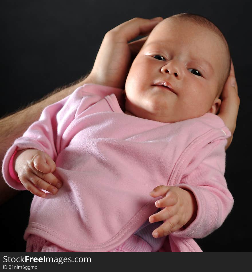 Little baby in dad's hands