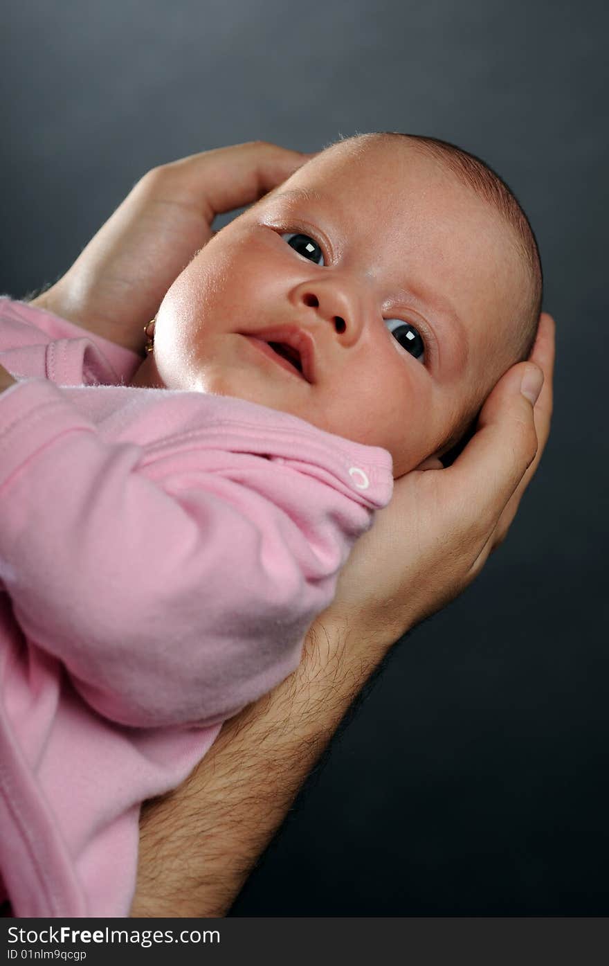 Little baby in dad's hands