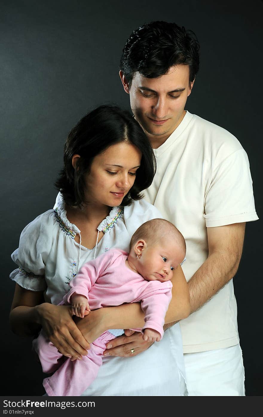 Happy family mother, dad and baby