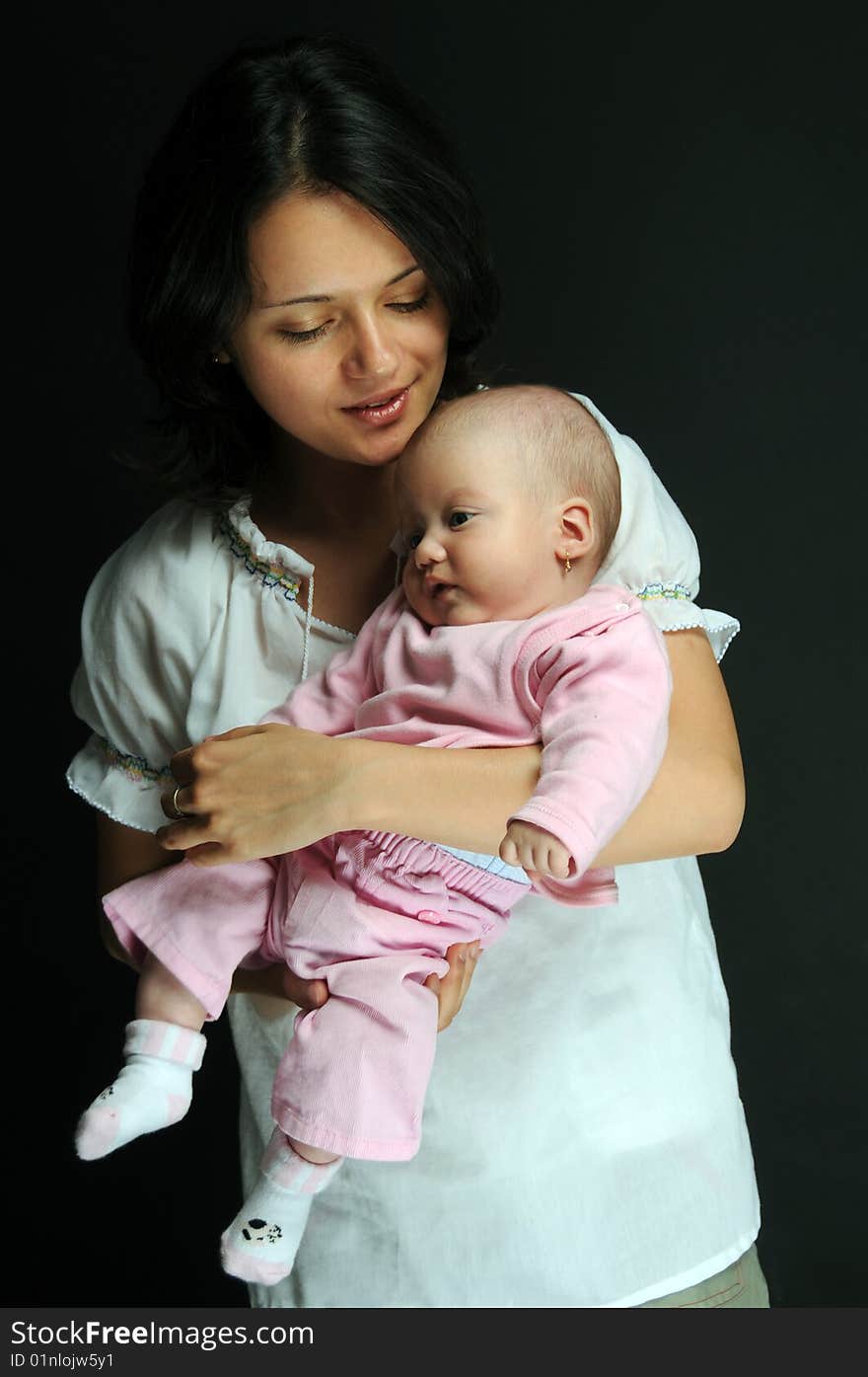 Mom and little baby girl over white background