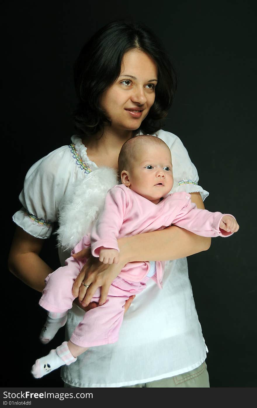 Mom and little baby girl over white background